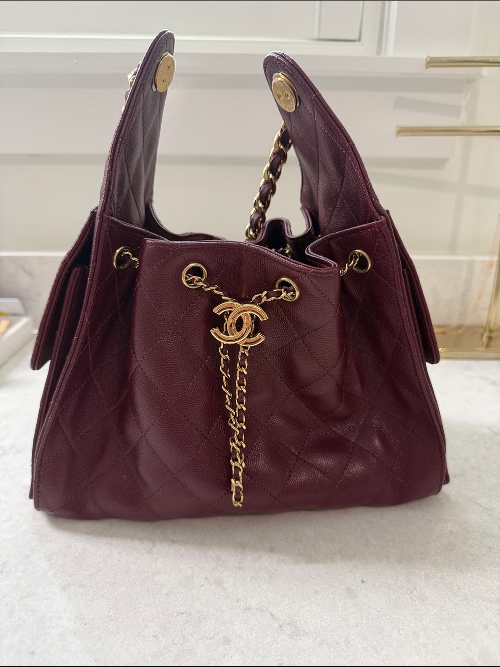 CHANEL Quilted Drawstring Shoulder Bag in Dark Burgundy